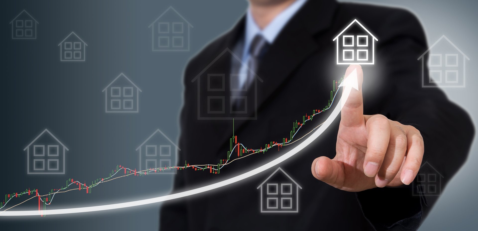 Businessman Touching a Graph Indicating Growth.